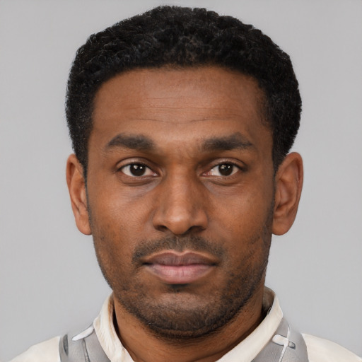 Neutral black young-adult male with short  black hair and brown eyes
