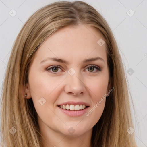 Joyful white young-adult female with long  brown hair and brown eyes