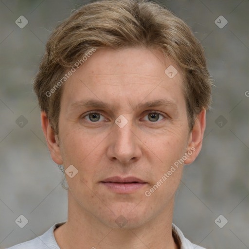 Joyful white adult male with short  brown hair and grey eyes