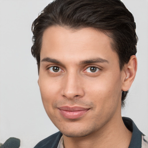 Joyful white young-adult male with short  brown hair and brown eyes