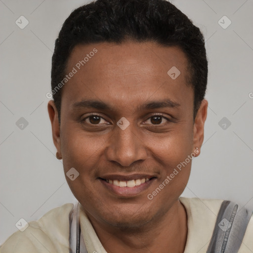 Joyful black young-adult male with short  black hair and brown eyes