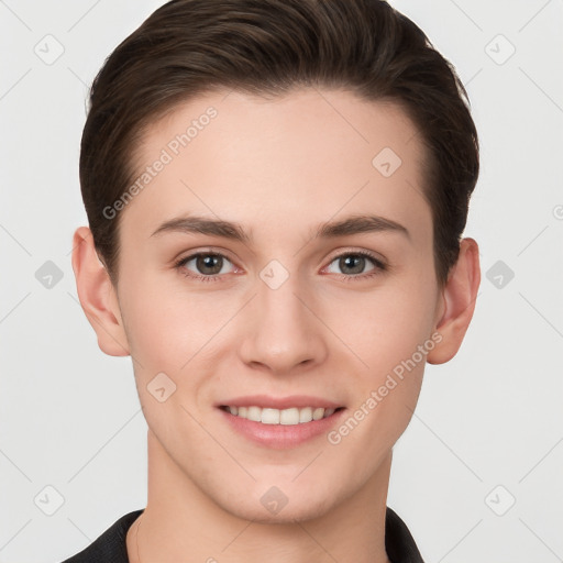 Joyful white young-adult female with short  brown hair and grey eyes