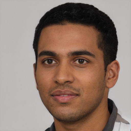 Neutral latino young-adult male with short  black hair and brown eyes
