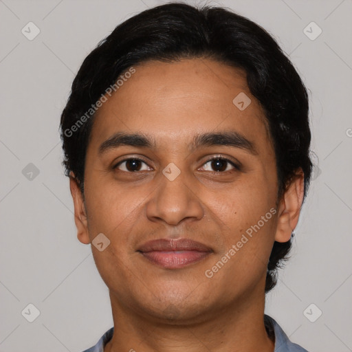 Joyful latino young-adult male with short  black hair and brown eyes