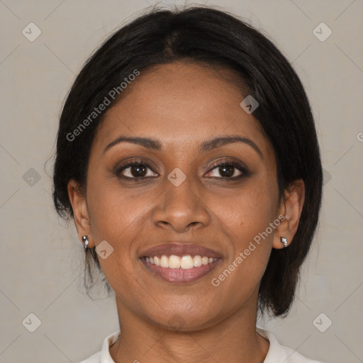 Joyful black young-adult female with medium  brown hair and brown eyes