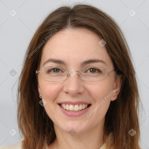 Joyful white adult female with medium  brown hair and brown eyes