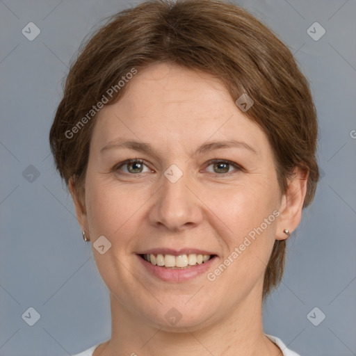 Joyful white adult female with medium  brown hair and grey eyes