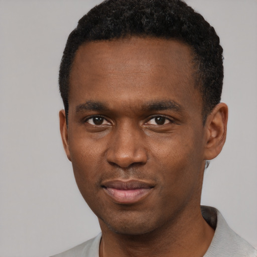 Neutral black young-adult male with short  brown hair and brown eyes