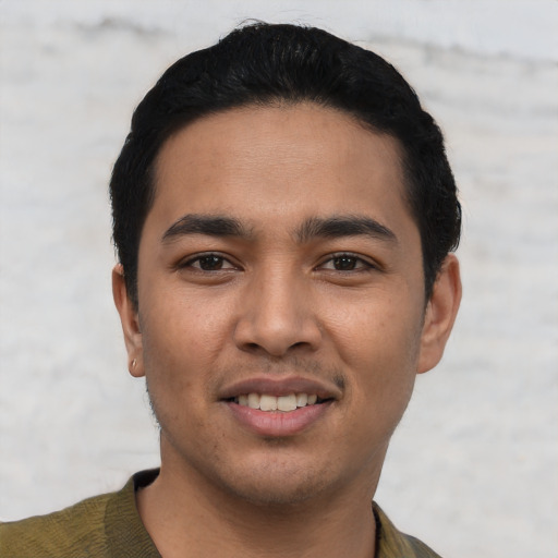 Joyful asian young-adult male with short  black hair and brown eyes