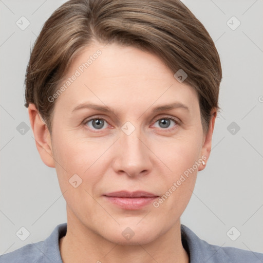 Joyful white adult female with short  brown hair and grey eyes