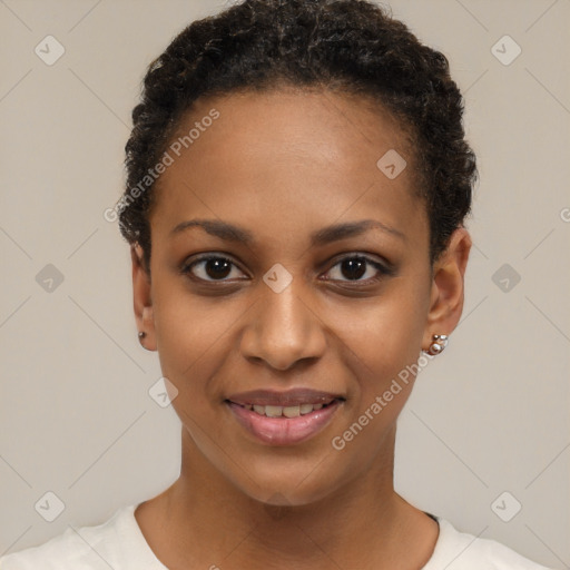 Joyful black young-adult female with short  black hair and brown eyes