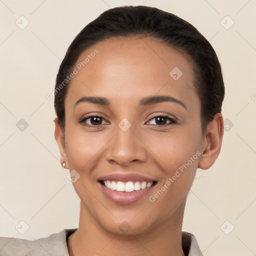 Joyful latino young-adult female with short  brown hair and brown eyes