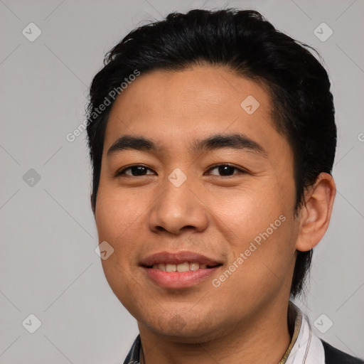 Joyful asian young-adult male with short  black hair and brown eyes