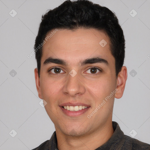 Joyful white young-adult male with short  black hair and brown eyes