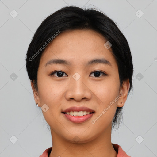 Joyful asian young-adult female with short  black hair and brown eyes