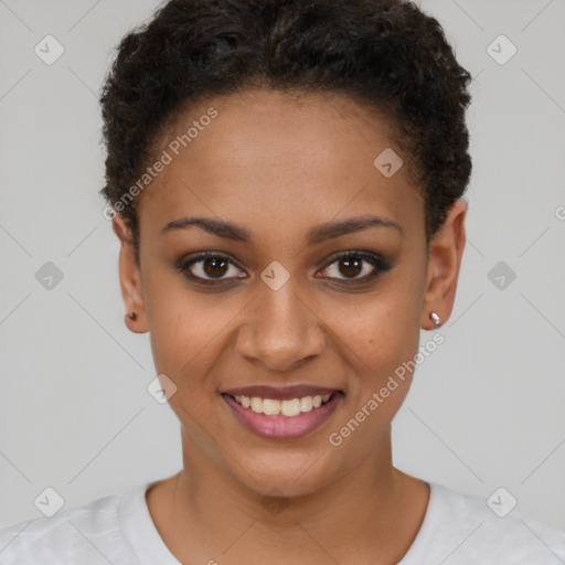 Joyful black young-adult female with short  brown hair and brown eyes