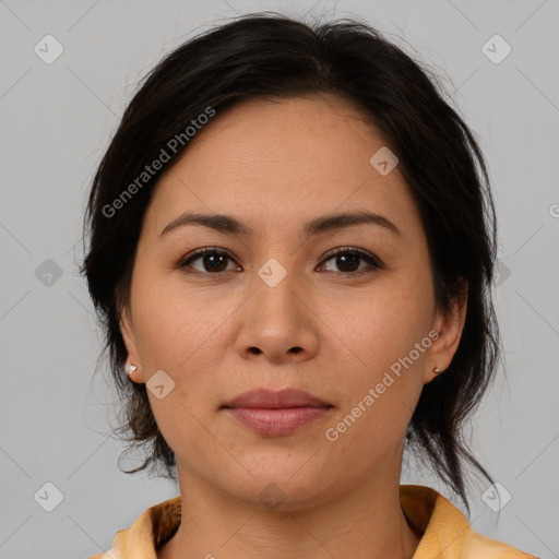 Joyful latino young-adult female with medium  brown hair and brown eyes