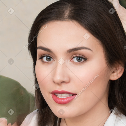 Neutral white young-adult female with medium  brown hair and brown eyes