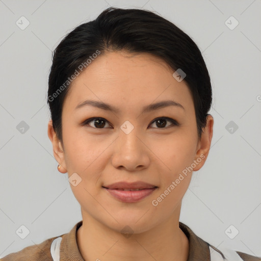 Joyful asian young-adult female with short  black hair and brown eyes