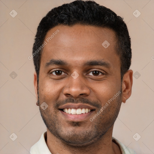 Joyful latino young-adult male with short  black hair and brown eyes