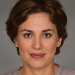 Joyful white adult female with short  brown hair and brown eyes