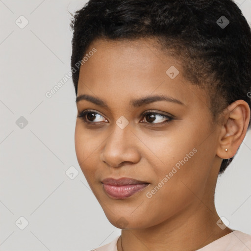 Joyful black young-adult female with short  brown hair and brown eyes