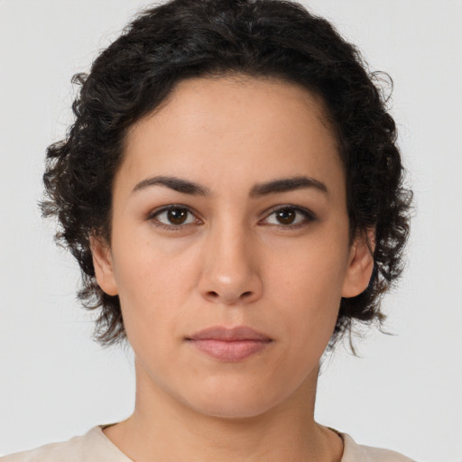 Neutral latino young-adult female with medium  brown hair and brown eyes