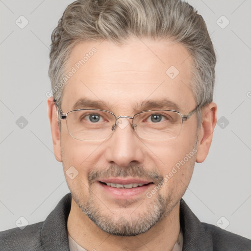 Joyful white middle-aged male with short  brown hair and brown eyes