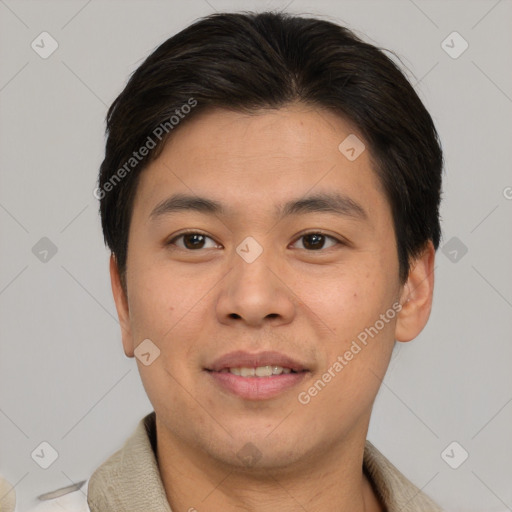 Joyful asian young-adult male with short  brown hair and brown eyes