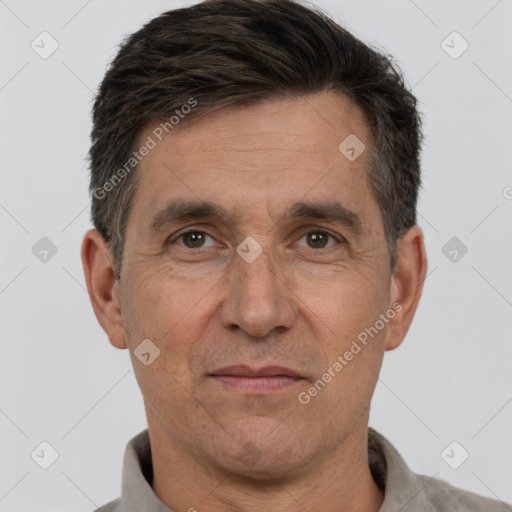 Joyful white adult male with short  brown hair and brown eyes