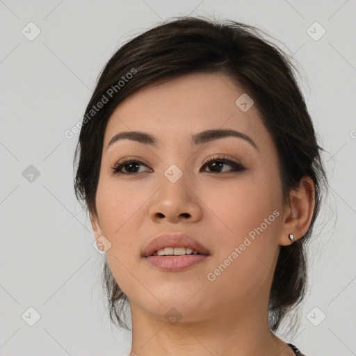 Joyful asian young-adult female with medium  brown hair and brown eyes