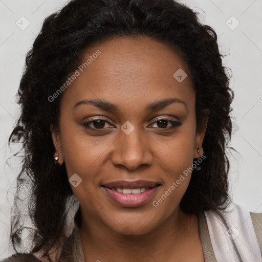 Joyful black young-adult female with long  brown hair and brown eyes