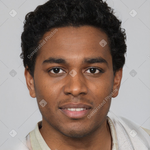 Joyful black young-adult male with short  brown hair and brown eyes