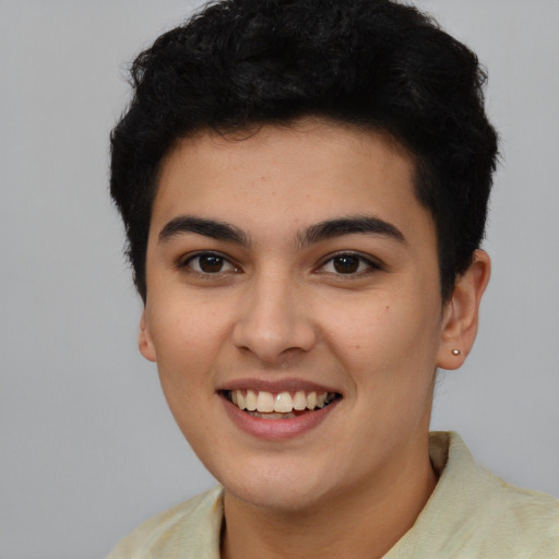 Joyful latino young-adult female with short  black hair and brown eyes