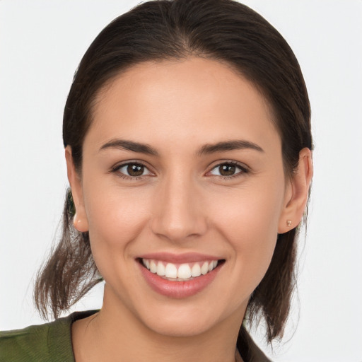 Joyful white young-adult female with medium  brown hair and brown eyes