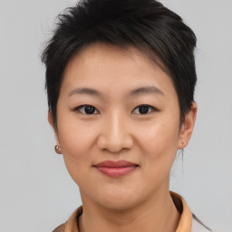 Joyful asian young-adult female with short  brown hair and brown eyes