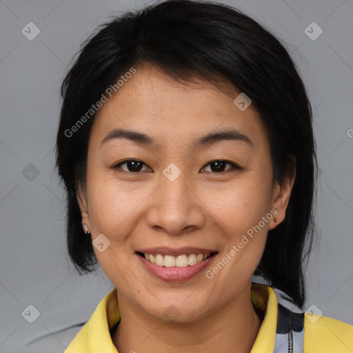 Joyful asian young-adult female with medium  brown hair and brown eyes