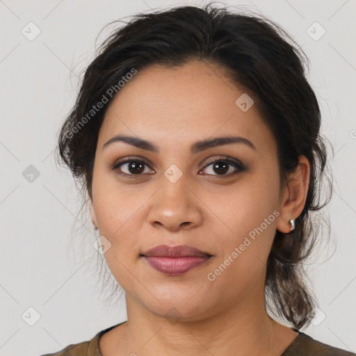 Joyful latino young-adult female with medium  brown hair and brown eyes