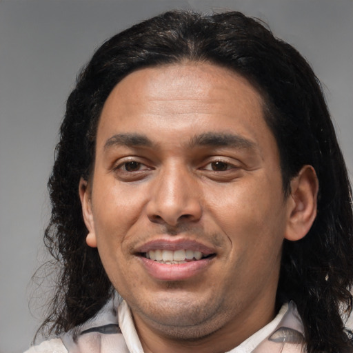Joyful black young-adult male with medium  brown hair and brown eyes