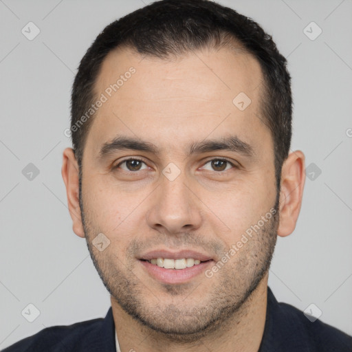 Joyful white young-adult male with short  black hair and brown eyes