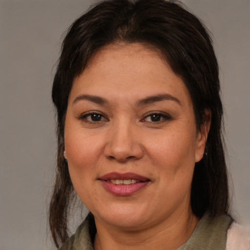 Joyful white young-adult female with medium  brown hair and brown eyes