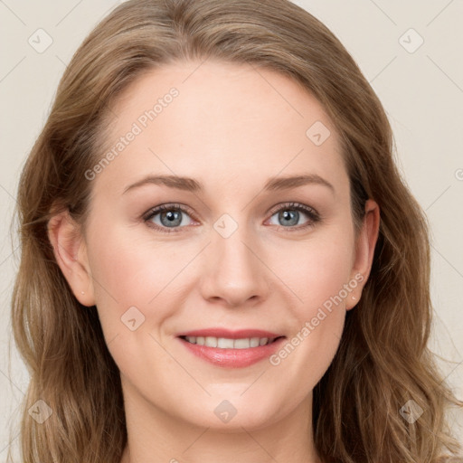 Joyful white young-adult female with long  brown hair and blue eyes