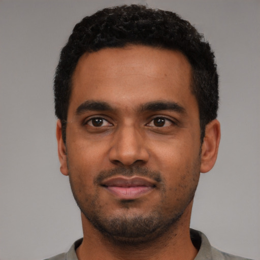 Neutral black young-adult male with short  black hair and brown eyes