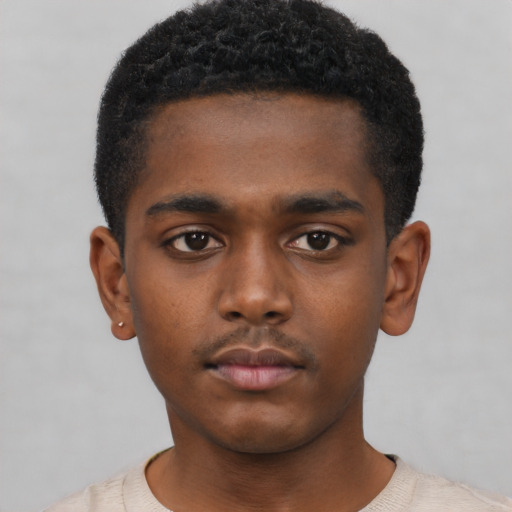 Neutral black child male with short  black hair and brown eyes