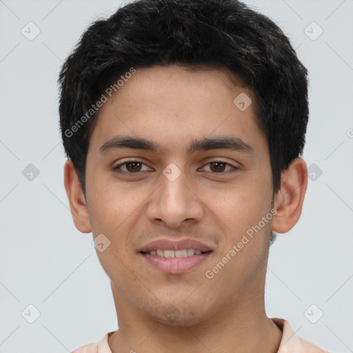 Joyful latino young-adult male with short  brown hair and brown eyes