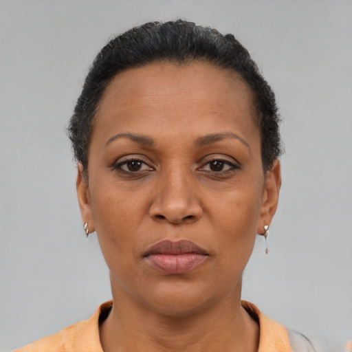 Neutral latino adult female with short  brown hair and brown eyes