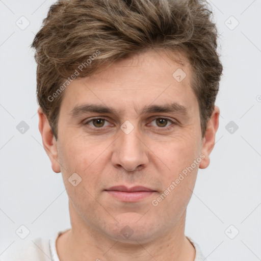 Joyful white adult male with short  brown hair and grey eyes