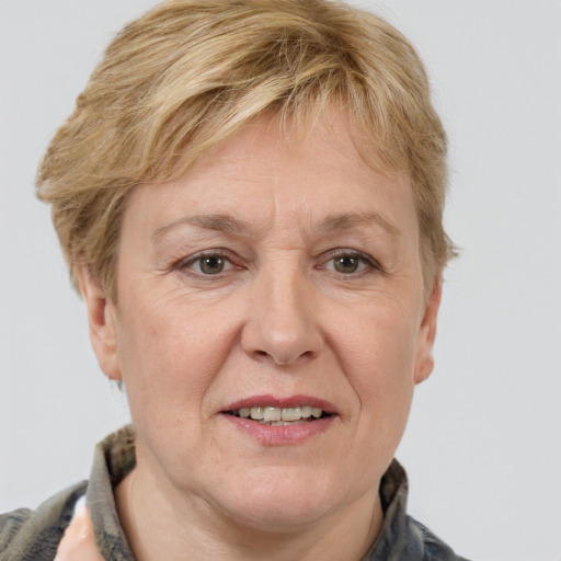 Joyful white middle-aged female with medium  brown hair and grey eyes