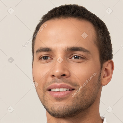 Joyful white young-adult male with short  black hair and brown eyes