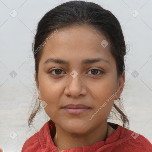 Joyful latino young-adult female with medium  brown hair and brown eyes